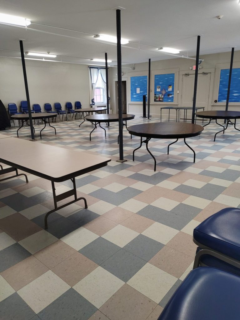 fellowship hall with tables and chairs