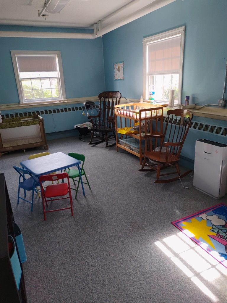 Church nursery with toys and rocking chairs